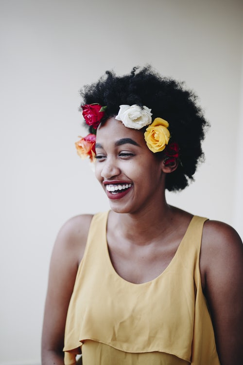 Woman being photographed for advert promoting being happy with your body